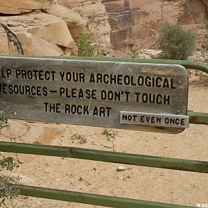 Sign on gate