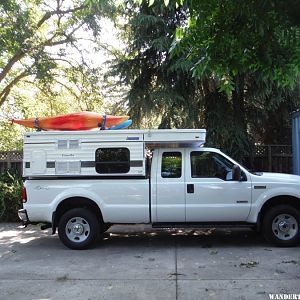 River boats on camper in driveway