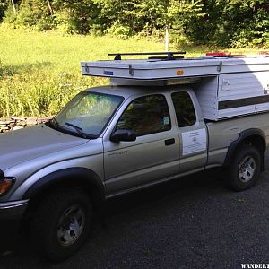 1 Our 2011 Eagle with a wind foil and solar panel box over cab.