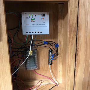 Control cabinets with Tracer 20 A MPPT solar charge controller, and Blue Sea fuse block and Negative bus bar