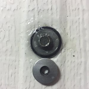 a little dome of urethane caulk, replacement bonded washers from Four Wheel