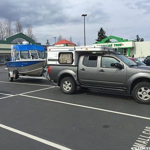 Truck and Camper towing 18 foot hewescraft searunner