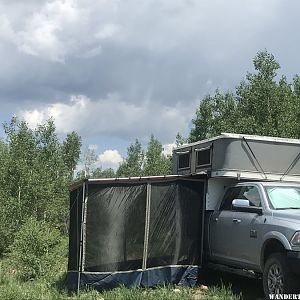 Granby camper popped up with awning and screen room