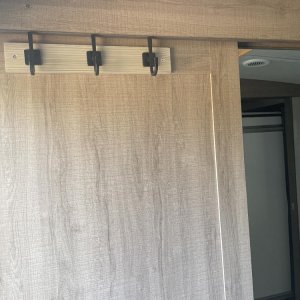 Coat hook mounted on bedroom slider