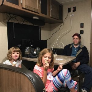 Noelle and Nora enjoying their first ice cream cones in the camper