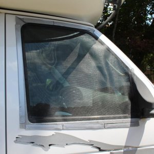 Wanted to be able to open cab window with out the bugs getting in. Screen and magnetic tape.