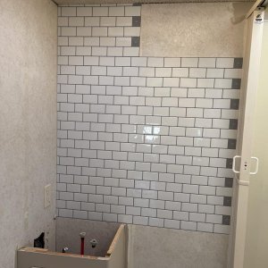 start of the subway tile in bathroom