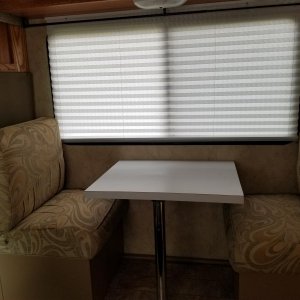 passenger side converted to dinette utilizing cushions from couch (bed)...and building custom box storage underneath...