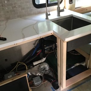 Work continues under the cabinet. Need to make the best use of the space. Note the diesel heater installed below the sink in the kick place.