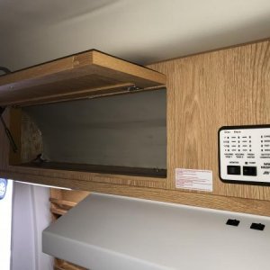 Over galley storage, tank monitors includes battery charge status and fresh water pump switch