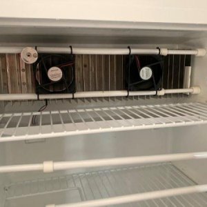 two small 12V fans were mounted in the refrigerator to circulate air, even out the temperature, reduce propane usage.
very easy install, no holes to d