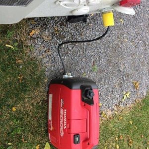 the little Honda generator runs the original 11,000 BTU AC without a problem
Fortunately we have never used it. We live in Canada so the AC has only b