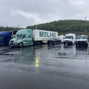 In the Canadian Maritimes RV can stay in some truck stops. This one even includes an RV dump station. Has a great restaurant, no charge. We were very 