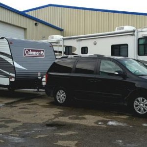 First hook-up.  I'm amused that my trailer and van length combined isn't any longer than the Class A beside me at the service bay!
2016 12 20 18.05.40