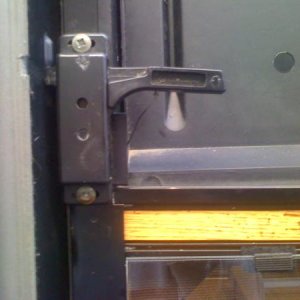 Screen door mod to open door without sliding panel all the time, Outside view of attachment point to lever