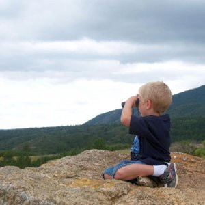 Liam scoping out helicopters at Fort Carson, CO - July 2010