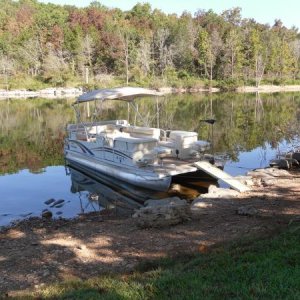 We love our pontoon also! Got a trolling motor on the front to fish around the points. That is a pet-step ramp going from shore to boat. Holds 300 lbs