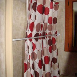 our shower curtain.. added a push rod to keep the shower curtain further out while taking a shower.