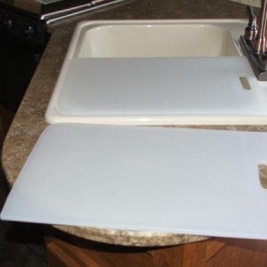 Sink covers my husband made out of cutting boards to fit sink. I had one big one for big sink but  I wanted two. Under the one on sink I like to keep 