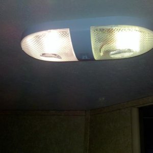 Same fixture, left original, right LED with covers on