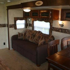 Couch w/Air Bed, Overhead Cabinets w/Glass Filled Doors