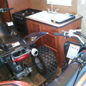 I carry two ATV's in my 19rr, A Honda 400ex and my son's Yamaha 250 Raptor, I can even fit the generator in front of the Honda when storing ...but put