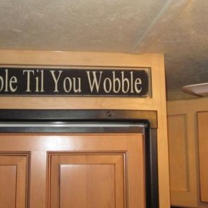 Above the fridge in our Windjammer was this unused indented section, so we found this sign on Ebay that fit in this area perfectly and matches DW's "t