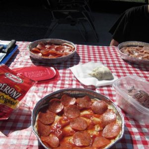 Preparing pizza's for some Dutch Oven cooking