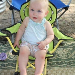 Our granddaughter, learning the fine art of sitting in the shade at camp on a hot afternoon, Memorial Day weekend 2012. (Van Buren S.P.)