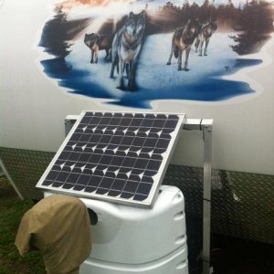 Propane Cover modded with an AL angle support frame to hold a 50 watt solar panel (charge controller is double sticked (3M automotive) under the solar