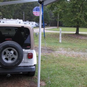 Telescopic posts made from PVC pipe and tie downs for the electric awning