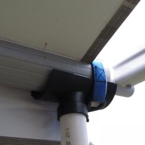 cradle and tie down strap for electric awning when extended