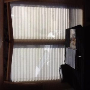 Picture is sideways...sorry
Replaced fabric drapes with day/ night shades with valances in the salon area