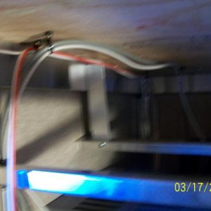 The 110V receptacle wiring, TV Cable, and 12V DC wiring for the compartment light were relocated from the position shown to the left against the wall.