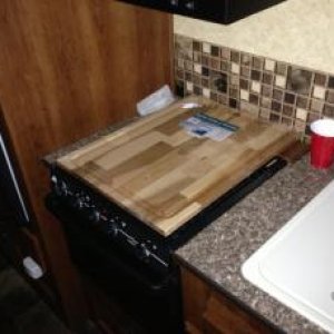 Stove top cover made from 24"x24" cutting board.