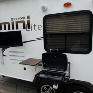 outdoor kitchen and tv