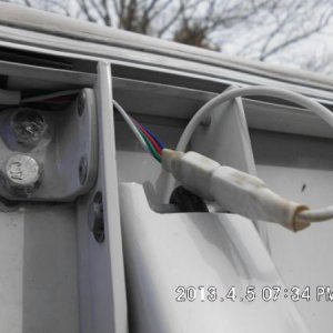 Awning LED plugged in with white shrink tube on connection