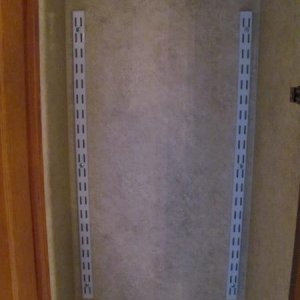 Keyhole strips installed equal-distance from top and bottom