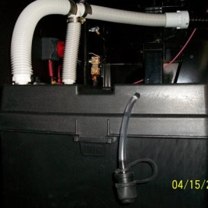 Battery Box Vents fabricated from left over Central Vacuum Hose.  Also shows JWP Battery Watering tube, which supplies water to both batteries when se