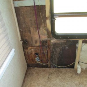 Bottom of wall. Wall extends several inches below floor.