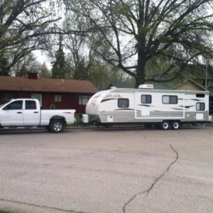 This is Duke, the truck and our previous Camper a 2013 grey wolf Cherokee 26DBH.