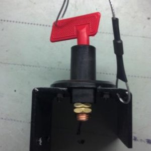 Battery Isolator switch mounted to plexiglas and key held on with cable to plexiglas