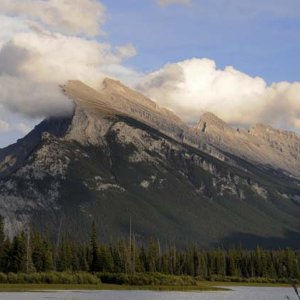 Snow and fog blowing across the ridge of a mountain outside of Banff.