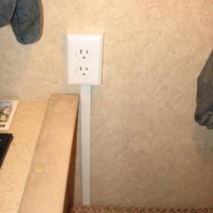 Added outlet next to the range. When in place, the back cushion hides the wire cover going up the wall.