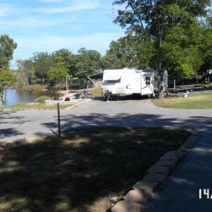 Pull thru site long enough to park the pontoon trailer, the TT, and 2 vehicles. Pulled the boat up to shore beside our site and had small gravel to se