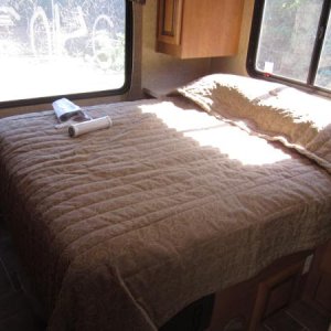 Queen Bed.  Note:  The bed is not in the slideout, the cabinets are.  Doesn't get as cold.  Bed has lots of storage under it.  Have to lift the bed up