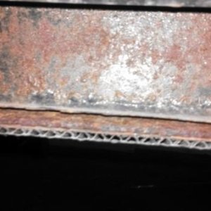 Paint completely lifted from the lower horizontal of the frame I-beam