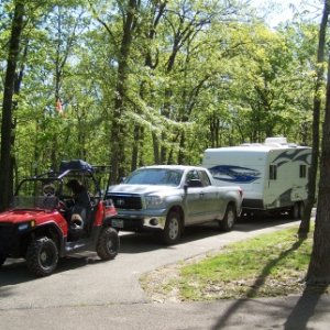 Typical camp site, water, electric dump station is available.  Table, fire ring and concrete patio slab.   Ride right from your camp site to riding ar