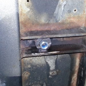 Screw the welded bolt!  Added nut with blue loctite.

Beware, there are lots of threads on Lippert steps having safety concerns.  This is a single ste