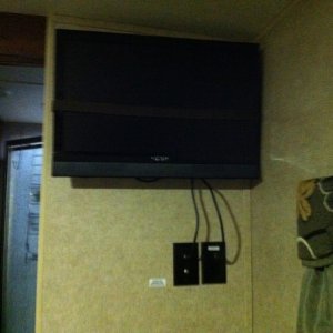 Installed Bedroom tv in travel position strapped to the wall